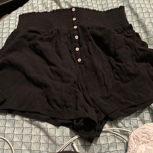 Tight waist black flare shorts with buttons down midline